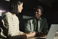 A Man and Woman Having a Meeting in the Office
