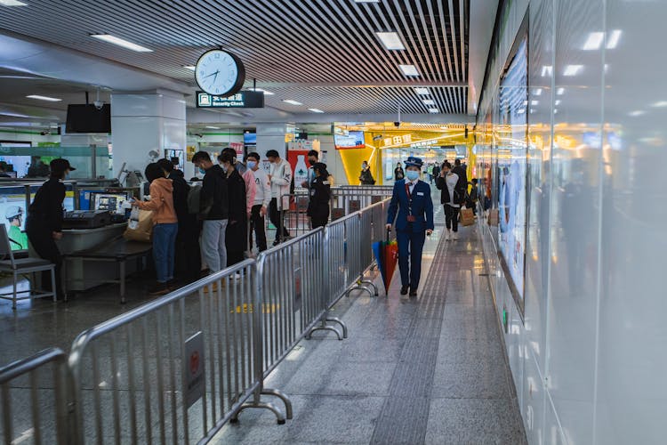 People Walking In The Airport