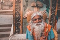 Elderly Hindu man with gray beard in town