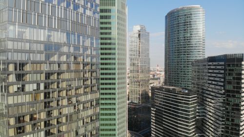 Free View of contemporary skyscrapers in Moscow with reflective glass facades on a clear day. Stock Photo