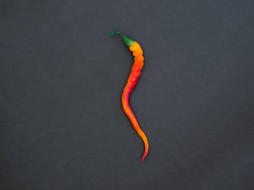 Free Close-Up Photo of a Red and Orange Chili Pepper Stock Photo