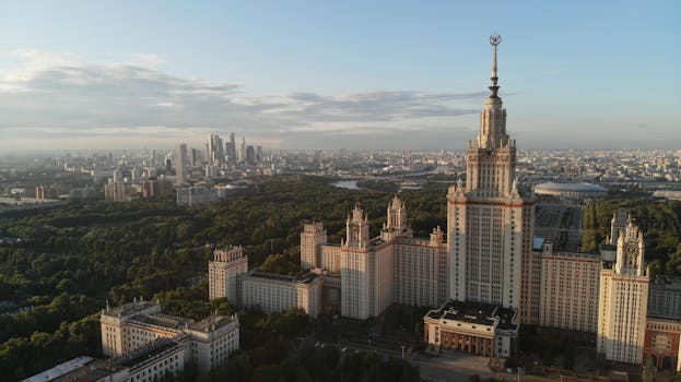 Stunning aerial view of Moscow State University with the city skyline in the background.
