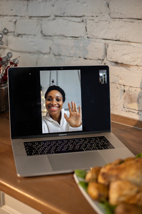 Macbook Pro on Brown Wooden Table