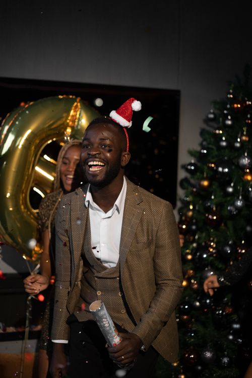 Free Joyful celebration with friends at a Christmas party, highlighting holiday spirit and fun. Stock Photo
