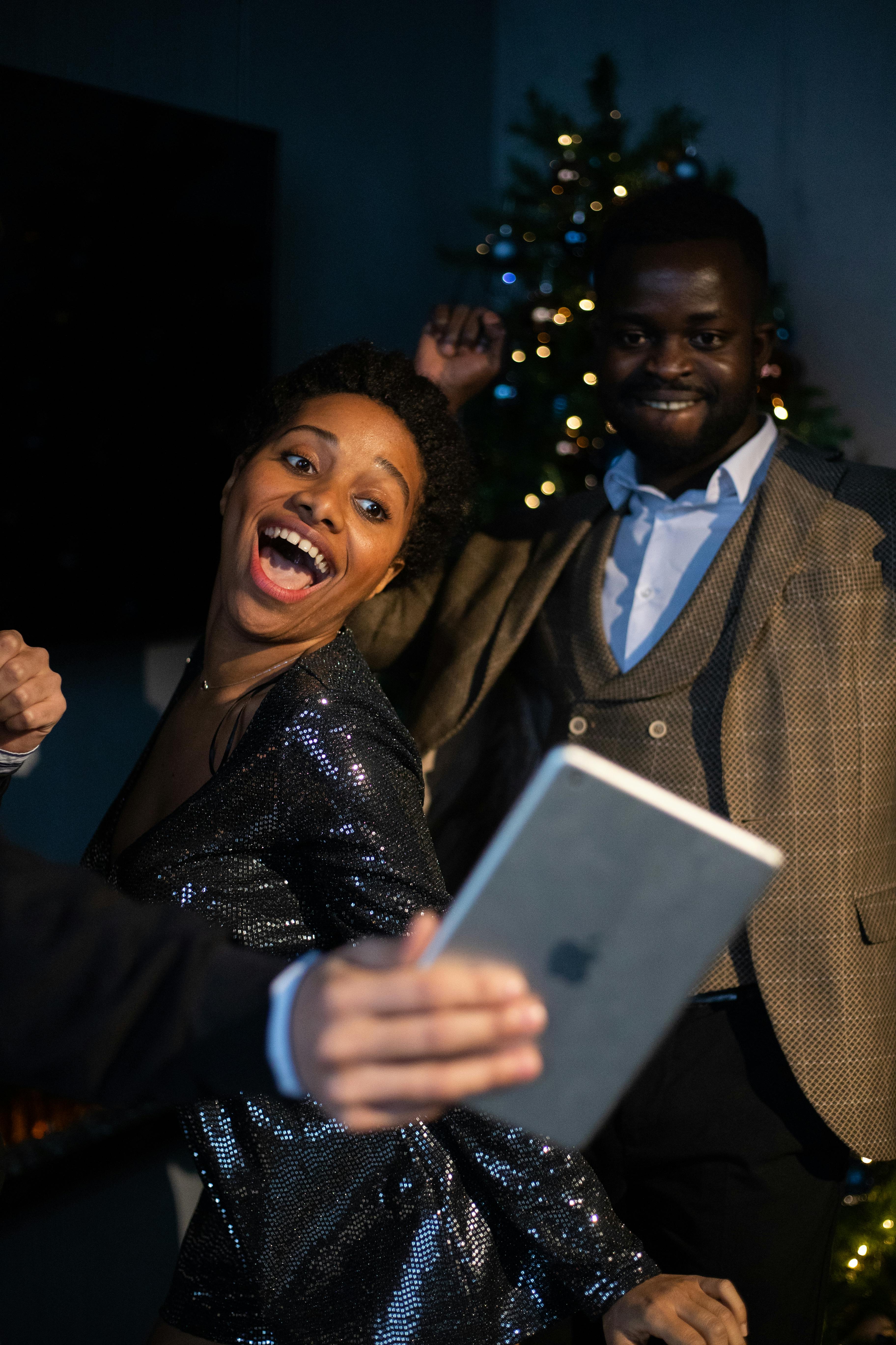 smiling woman holding a tablet