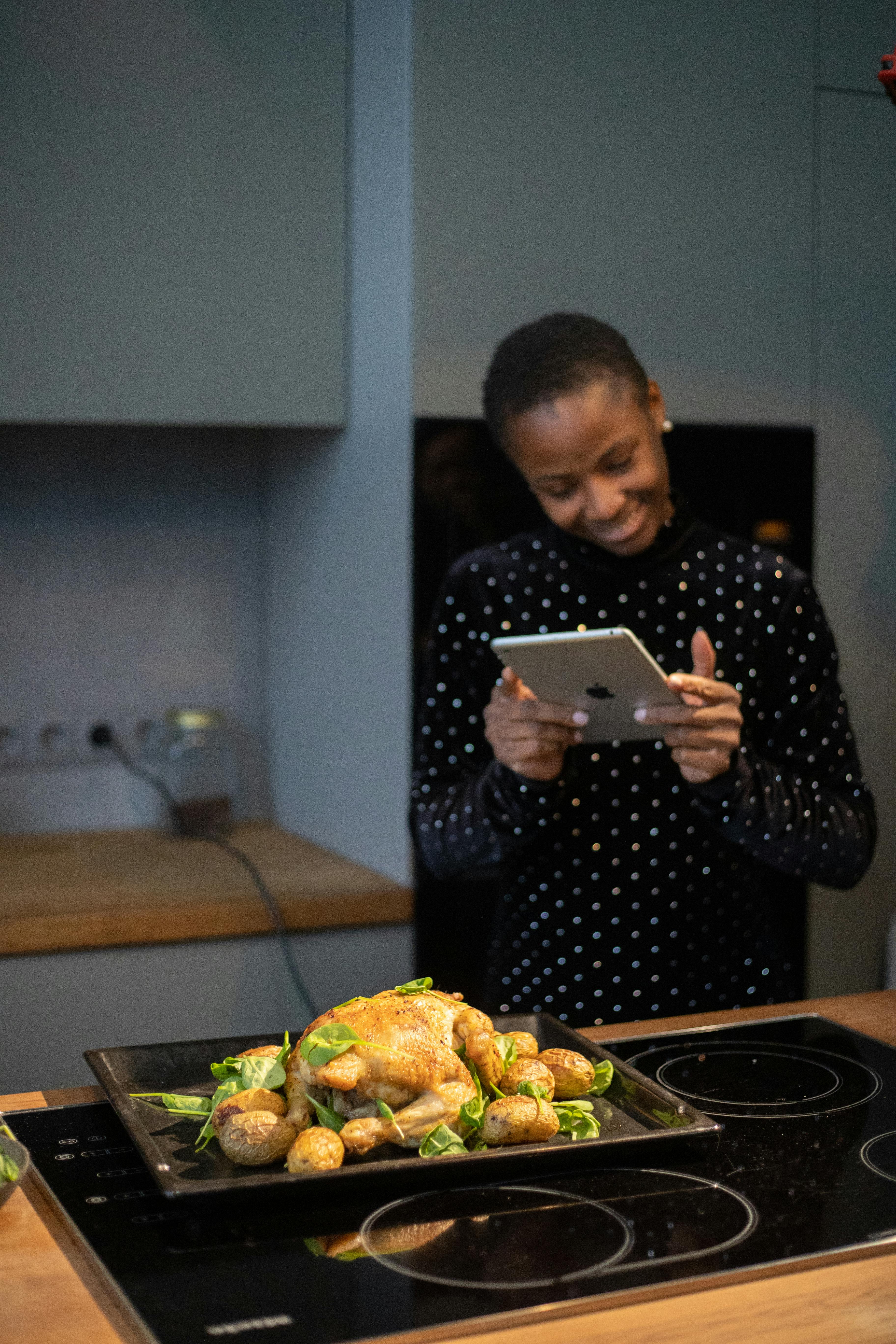 woman taking a picture of her dinner