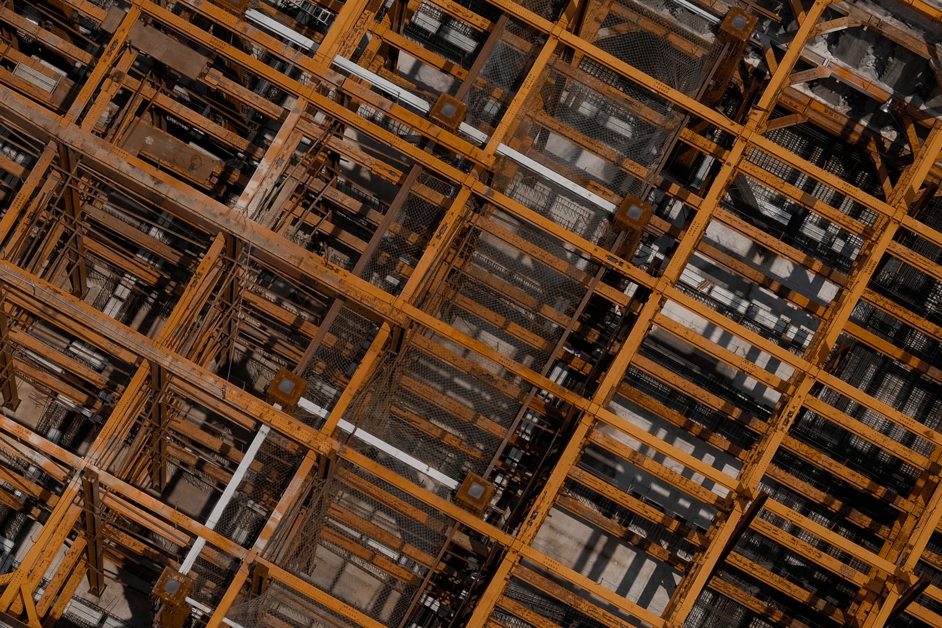 Detailed aerial shot of steel beams at a construction site in Taichung City.