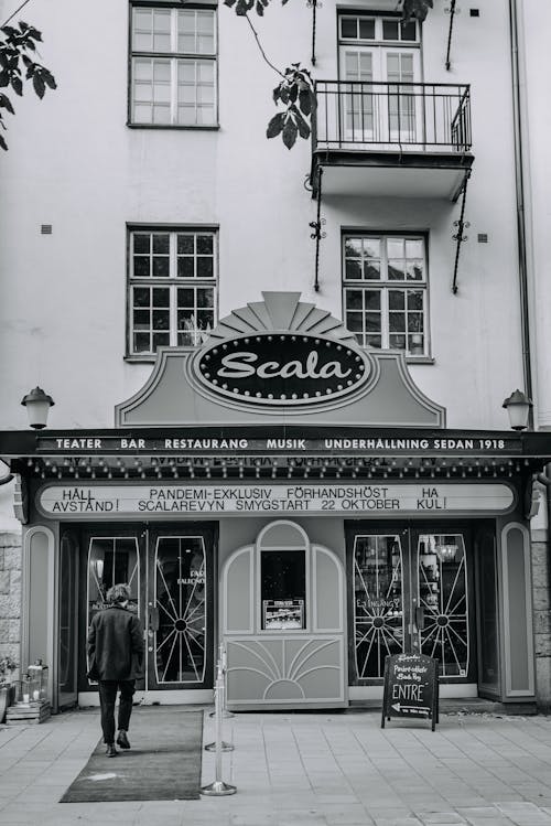 Grayscale Photo of Entrance to a Business Establishment