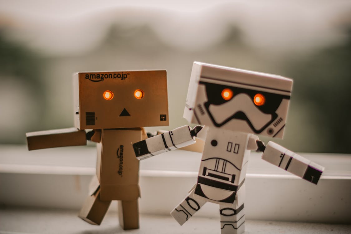 Selective Focus Photography of Two Danbo and Star Wars Stormtrooper Robot Toys