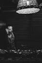 Grayscale Photo of a Dj on the Stage