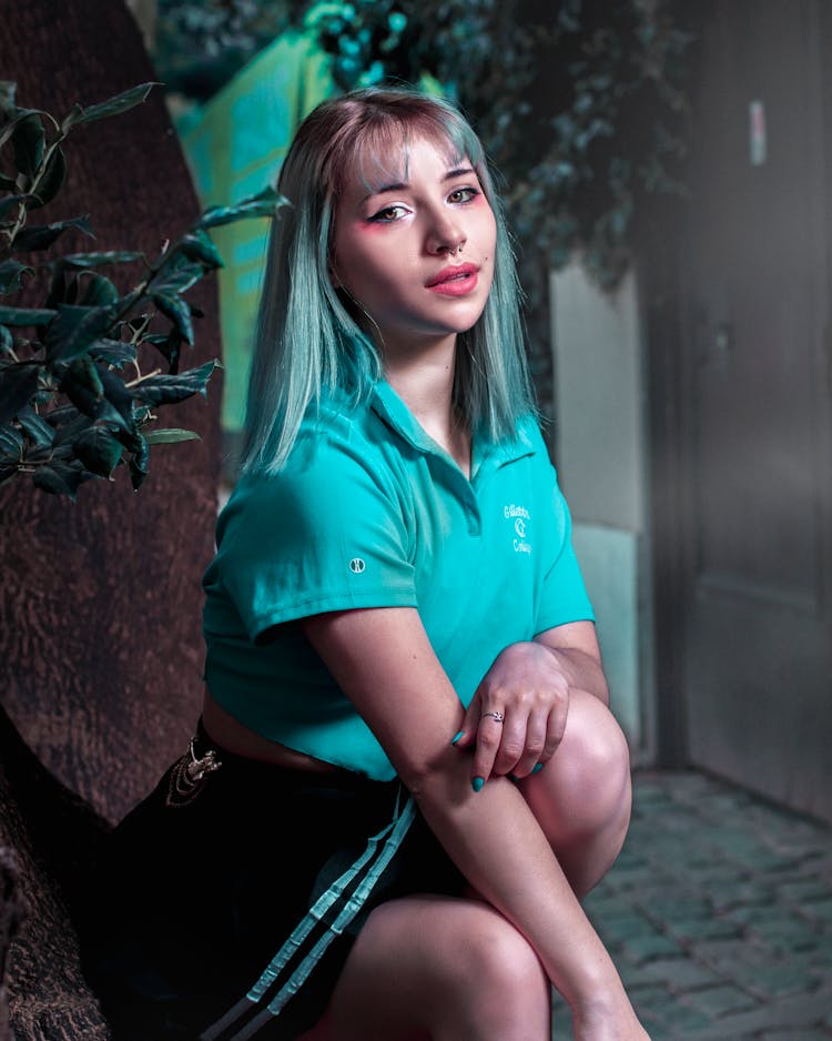 Woman In Blue Polo Shirt With Blue Hair Color