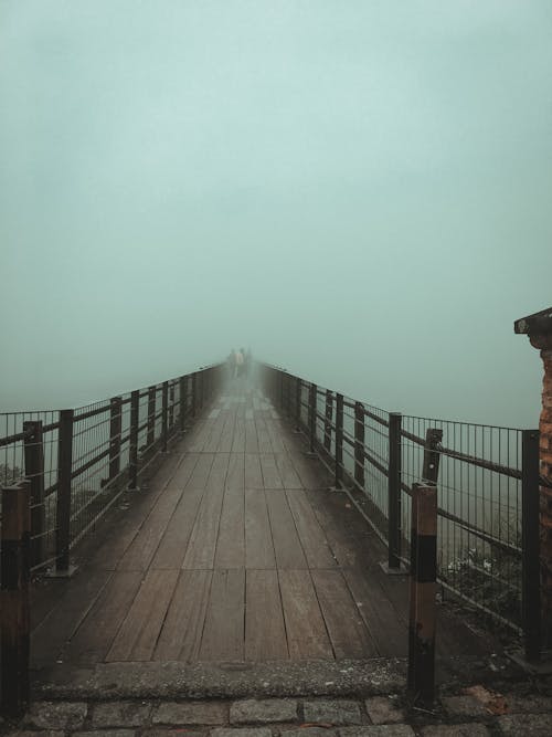 Brown Wooden Bridge with Thick Fog