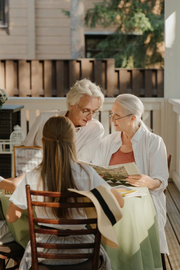 Elderly Couple Sitting In Veranda