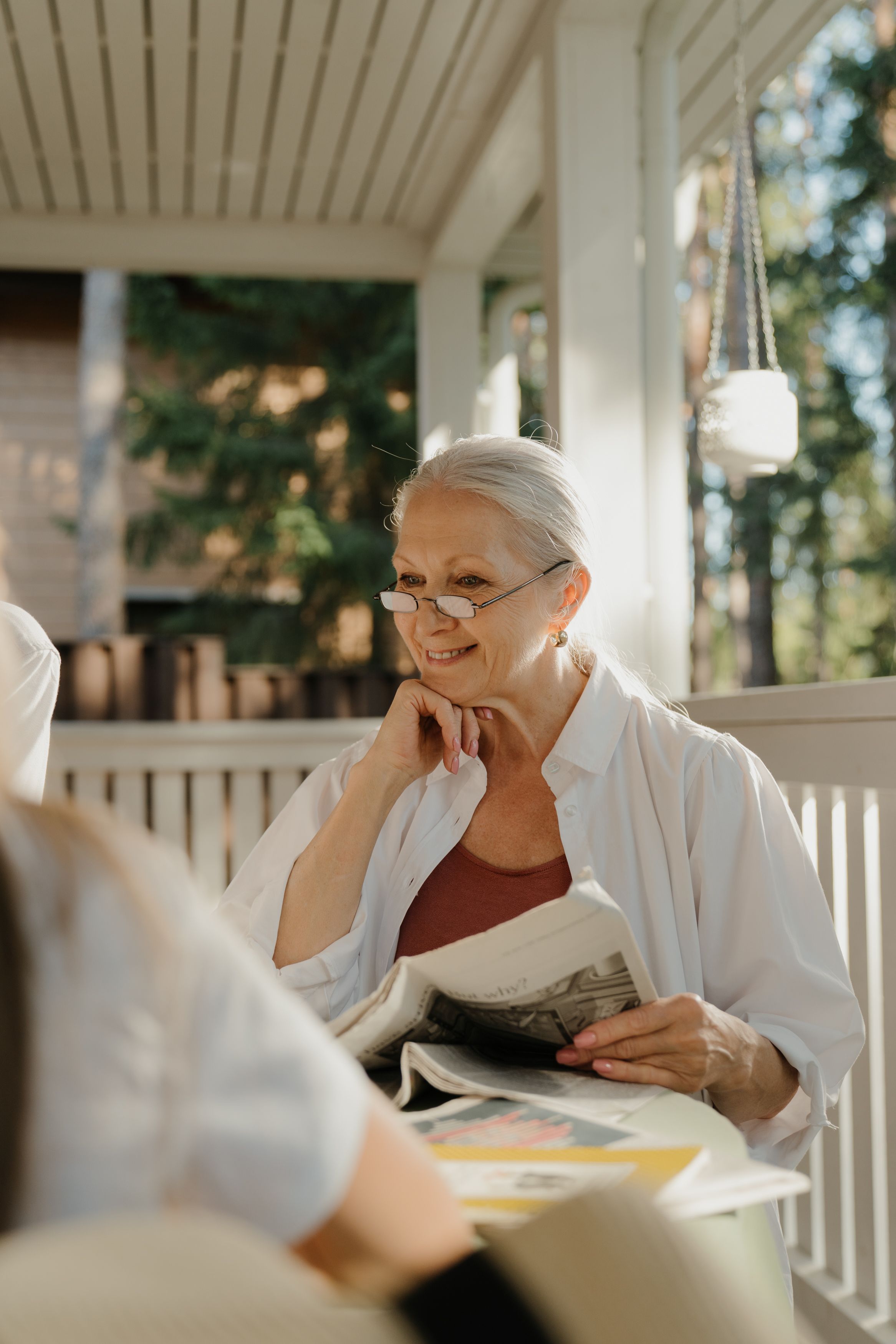 Reading the paper on the front porch
