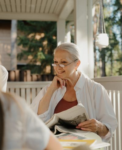 Reading the paper on the front porch