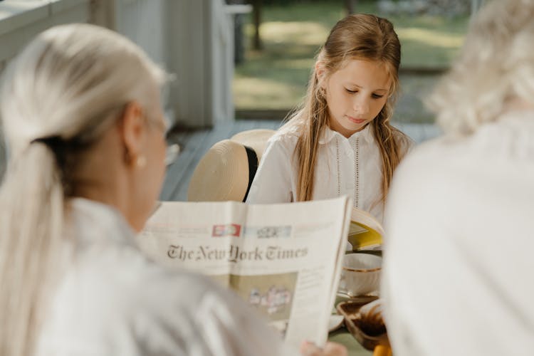 A Girl Reading A Book