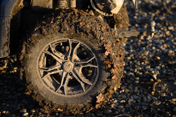 Close Up Photo Of A Muddy Tire