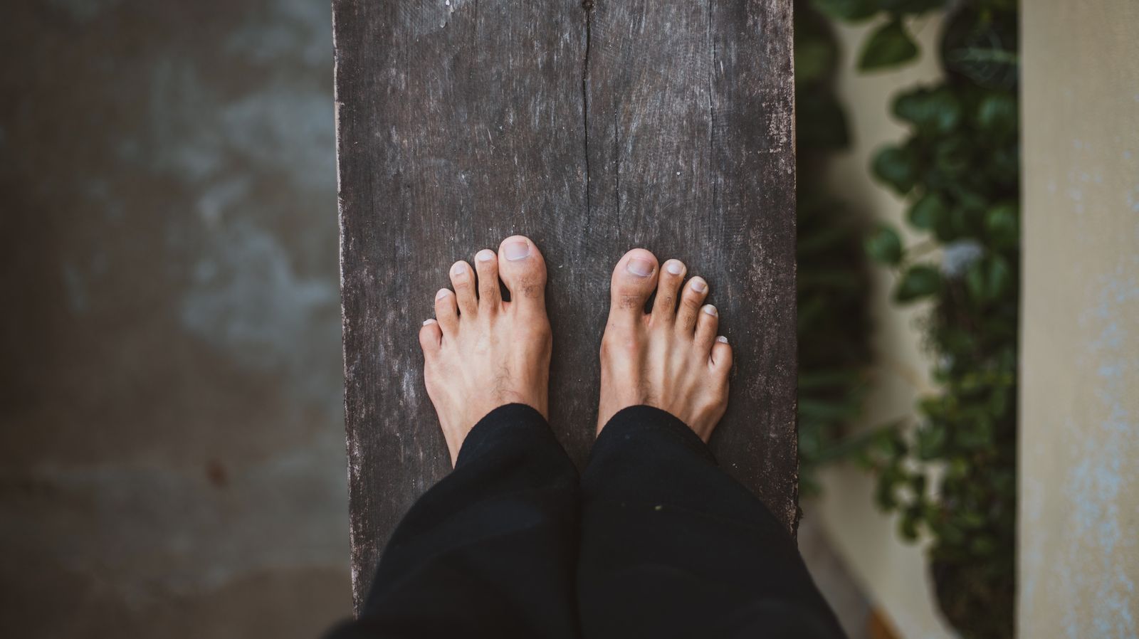 Runner adjusting an ankle before an outdoor run