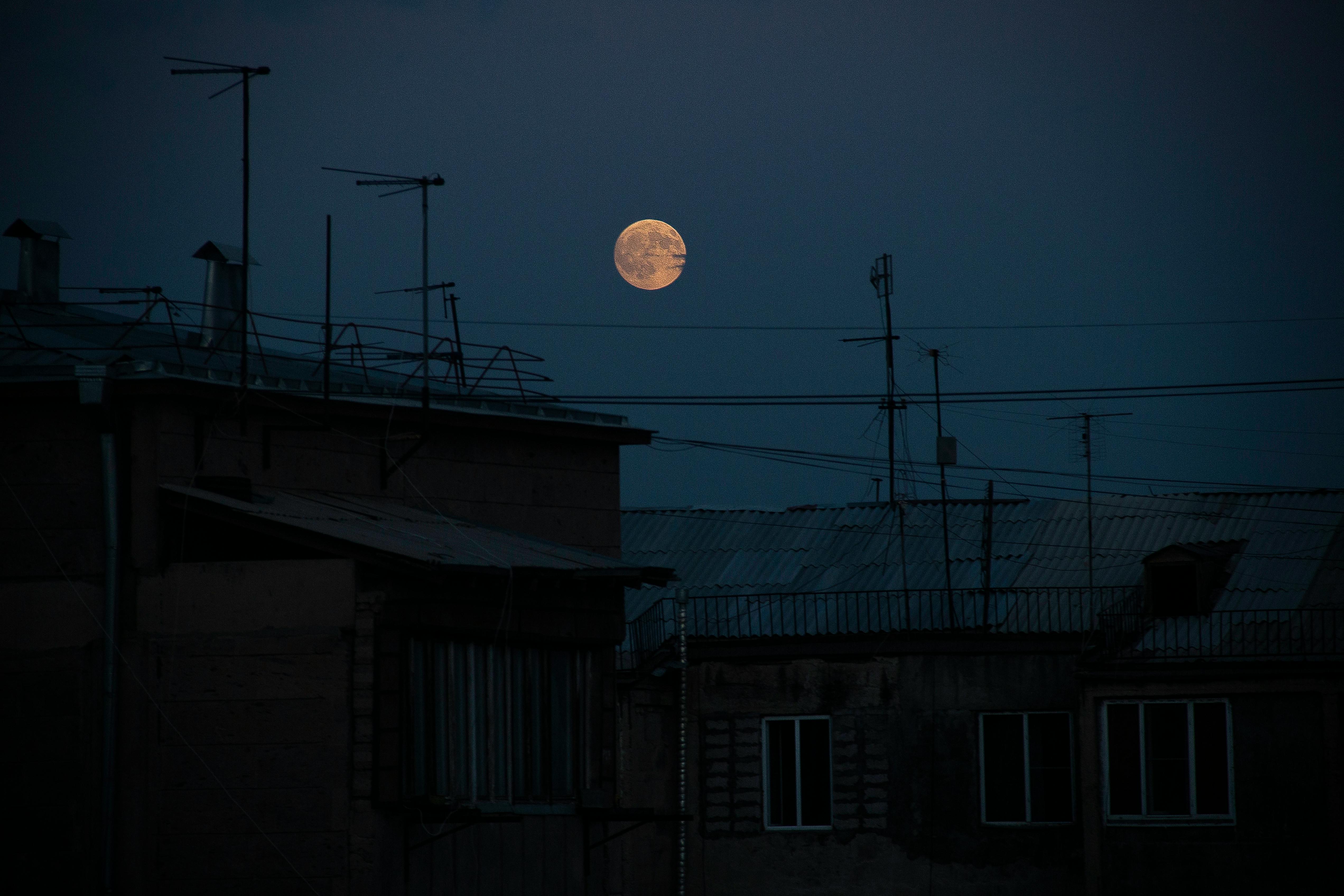 White Concrete Building Under Full Moon