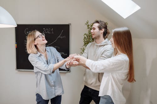 Office Team Huddling in the Room