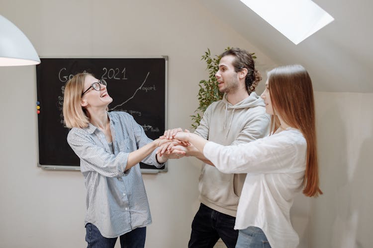 Office Team Huddling In The Room