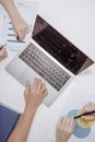 Person Using Macbook Pro on White Table