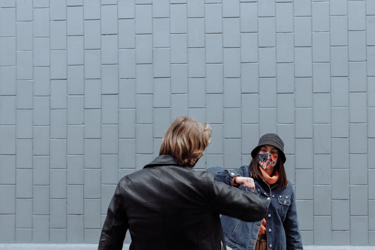 Man And Woman Doing Covid Handshake