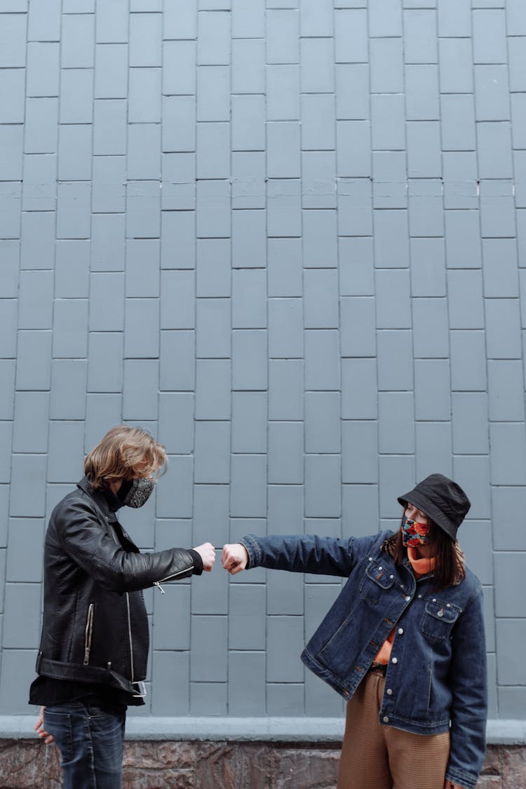 Man And Woman Doing Covid Handshake