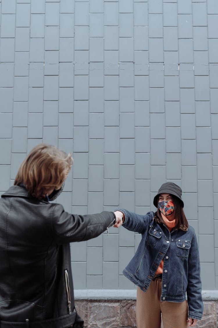 A Man And Woman Doing Fist Bump