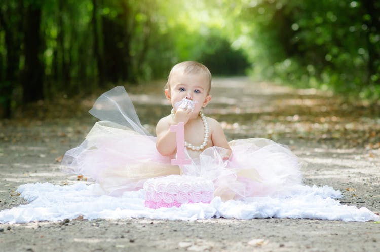 A Baby Eating A Cake