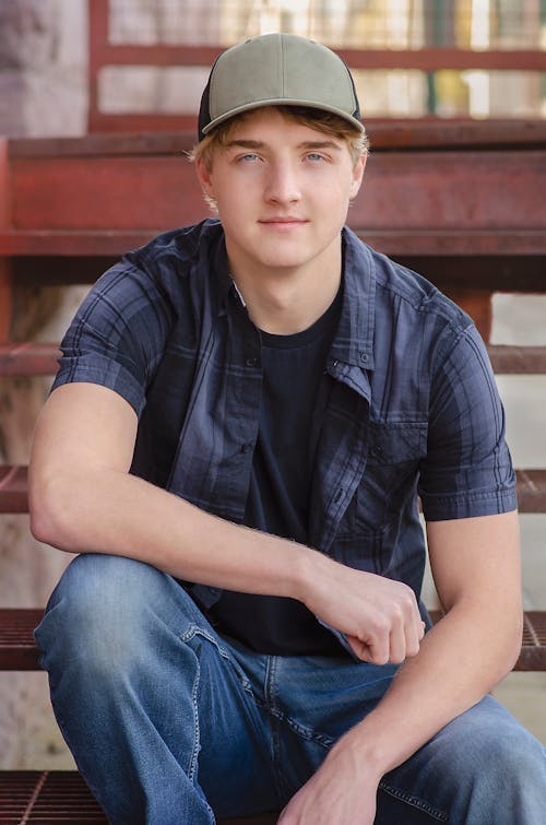 Photo of a Handsome Man in a Blue Polo Looking at the Camera