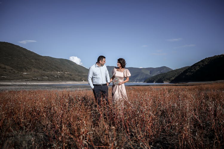 Romantic Elegant Couple In Valley With Mountains