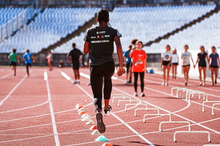 People Running On A Track 