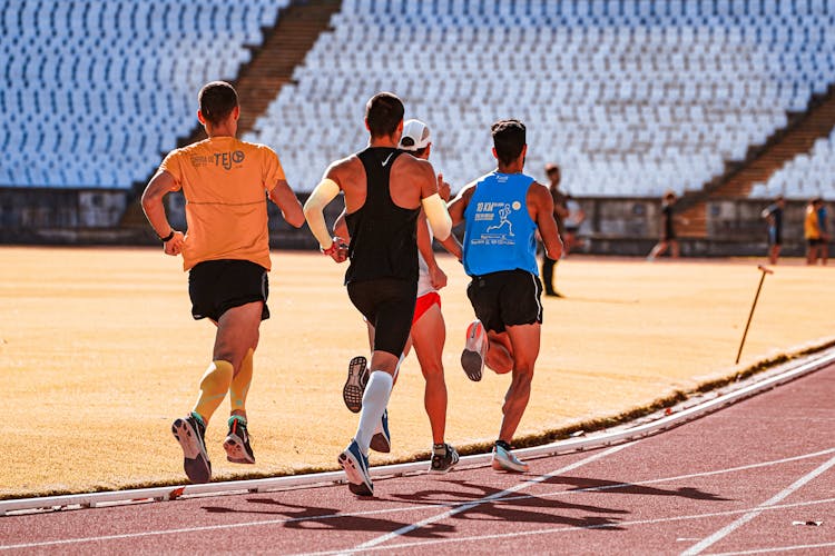 People Running On A Track 