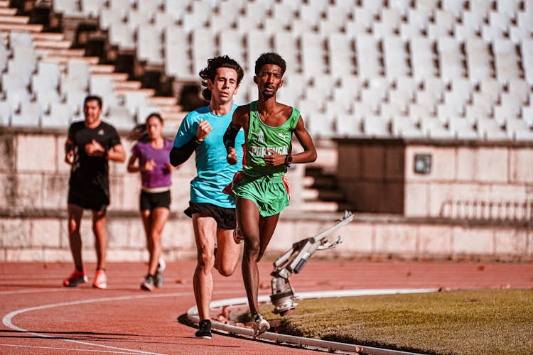 People Running On A Track 