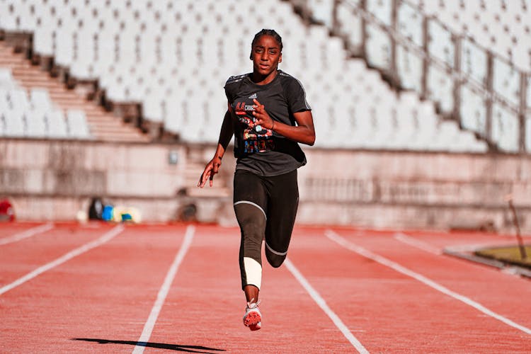 Woman Running On Track 