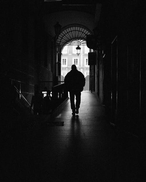 Free Silhouette of Person Walking on Hallway Stock Photo
