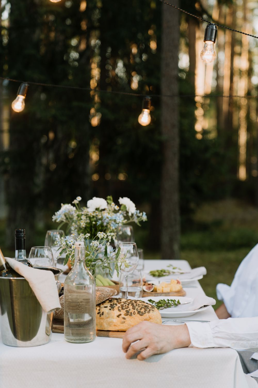 Festive dinner under string lights