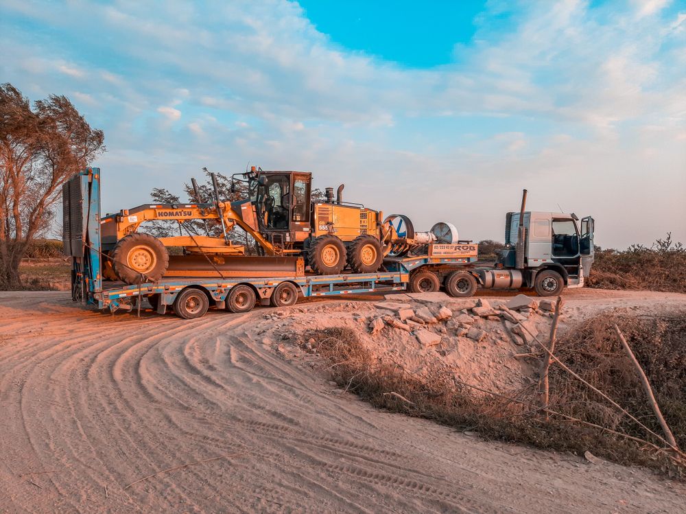 Lowbed trailer transporting heavy machinery