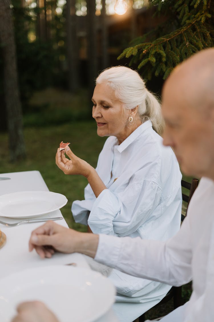 Elderly Woman Eating Food