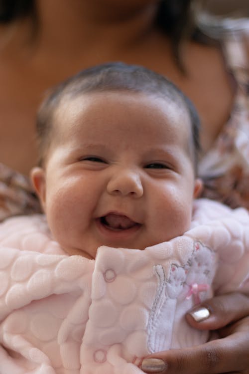 Close-Up Photo of a Baby Smiling