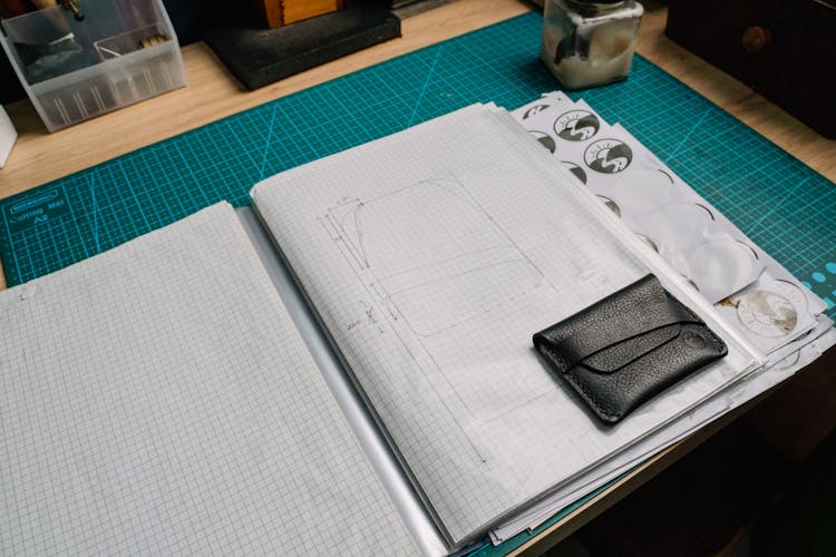 Black Leather Bifold Wallet On White Paper