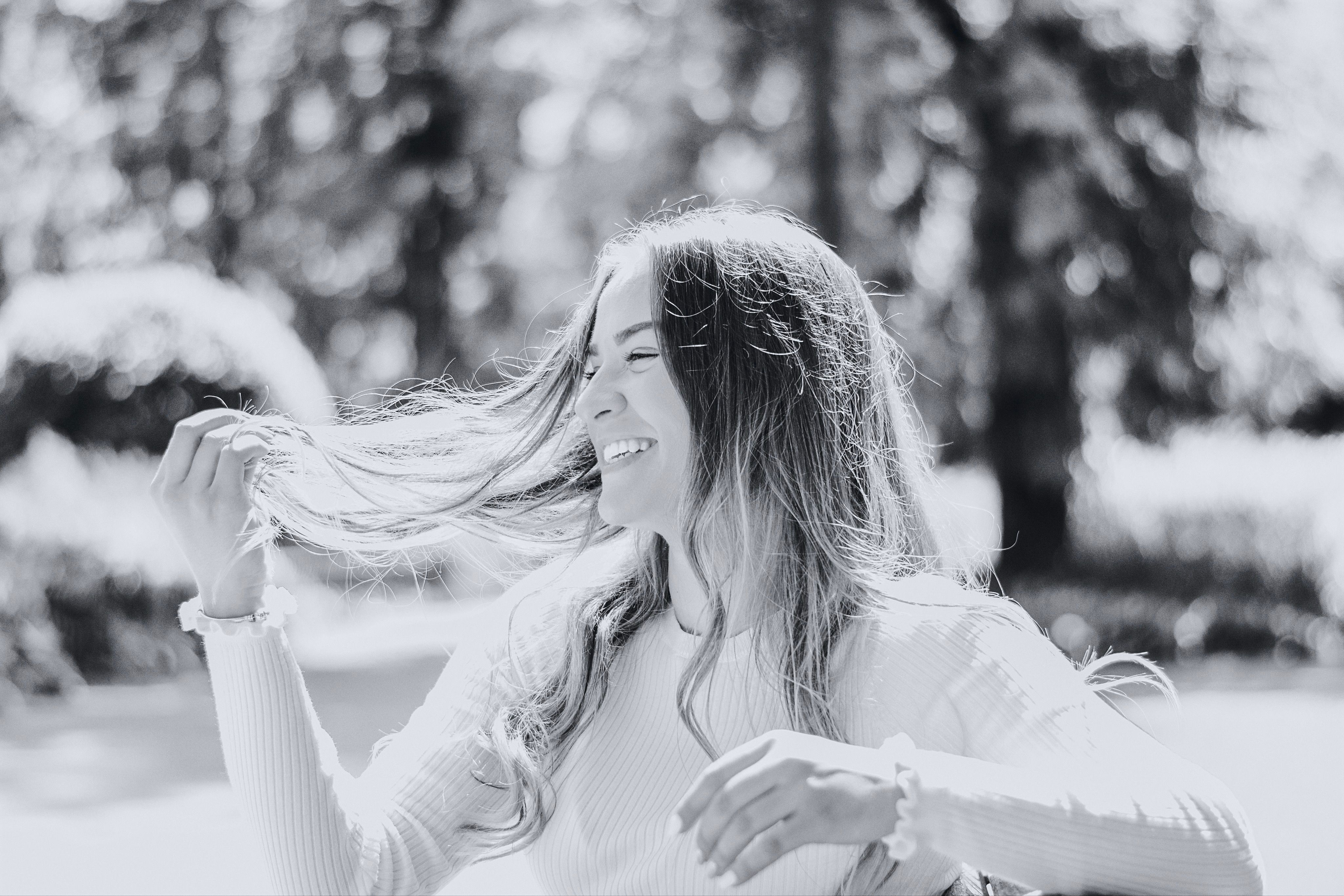 Grayscale Photo of Smiling Woman in White Long Sleeve Shirt · Free ...