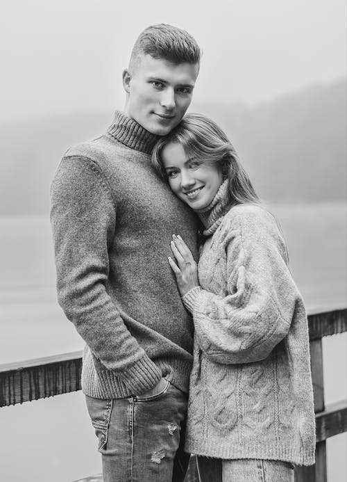 Free Grayscale Photo of Woman Hugging a Man Stock Photo