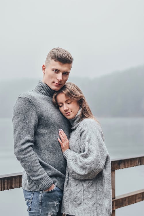 Free Woman Leaning on Man's Chest Stock Photo