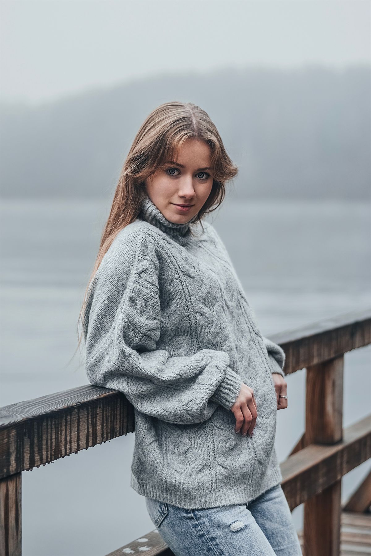 Woman in elevated sweater and jeans outfit