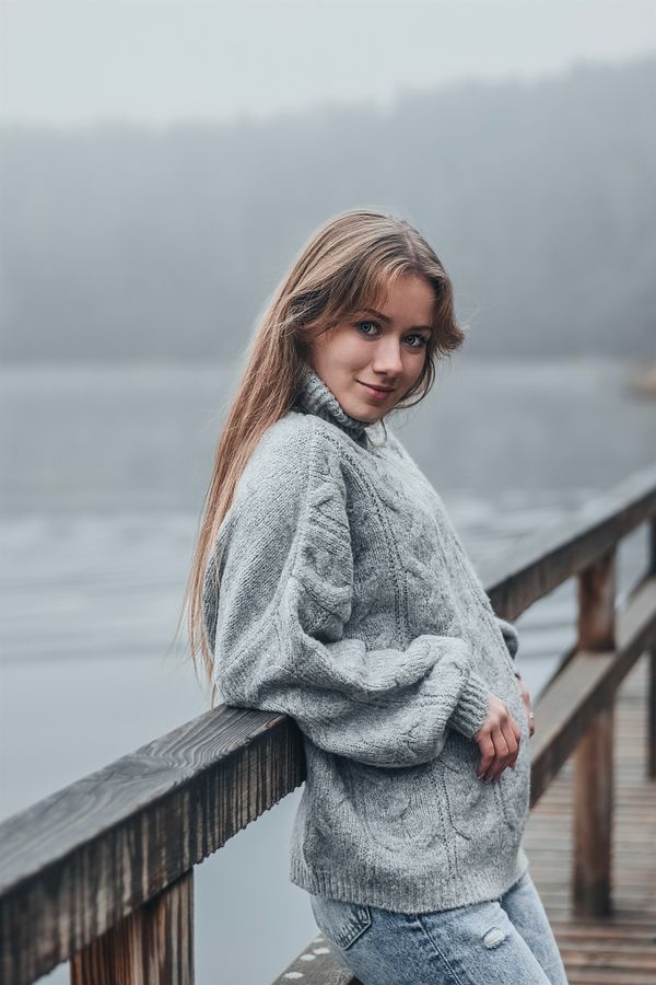 Woman in white jeans with cozy winter sweater
