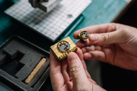Brass maker stamps in hand, photo by Anna Tarazevich on Pexels
