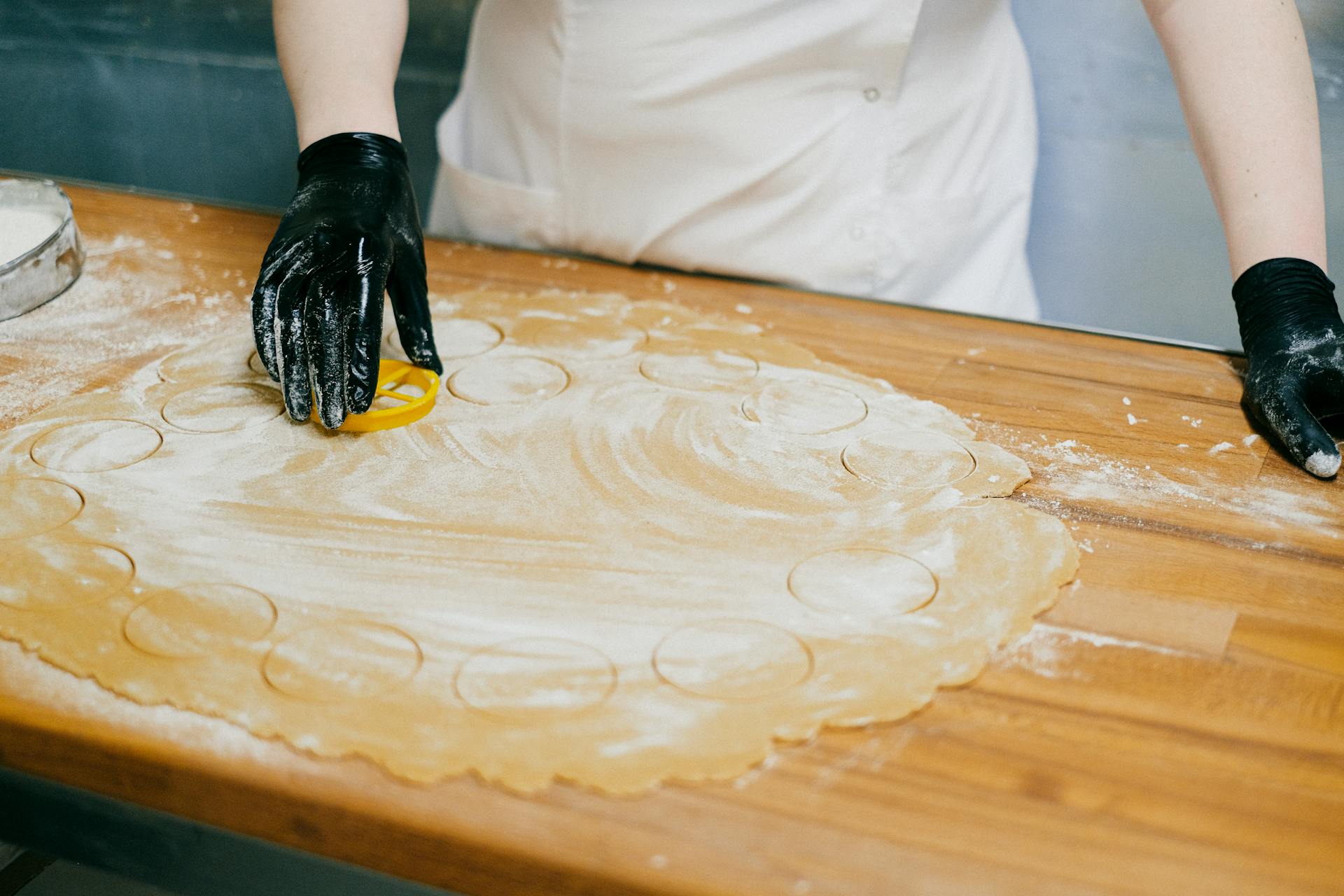 Woman Cutting Circles in Dough