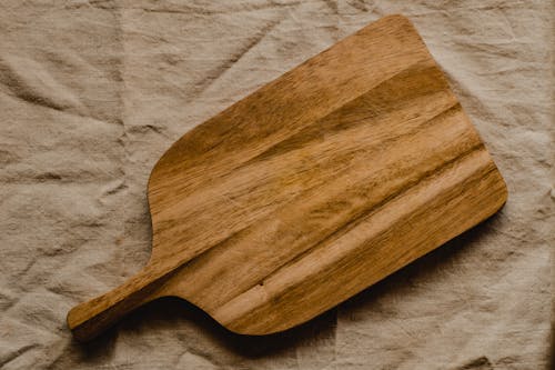 Free Wooden Chopping Board on Brown Textile Stock Photo